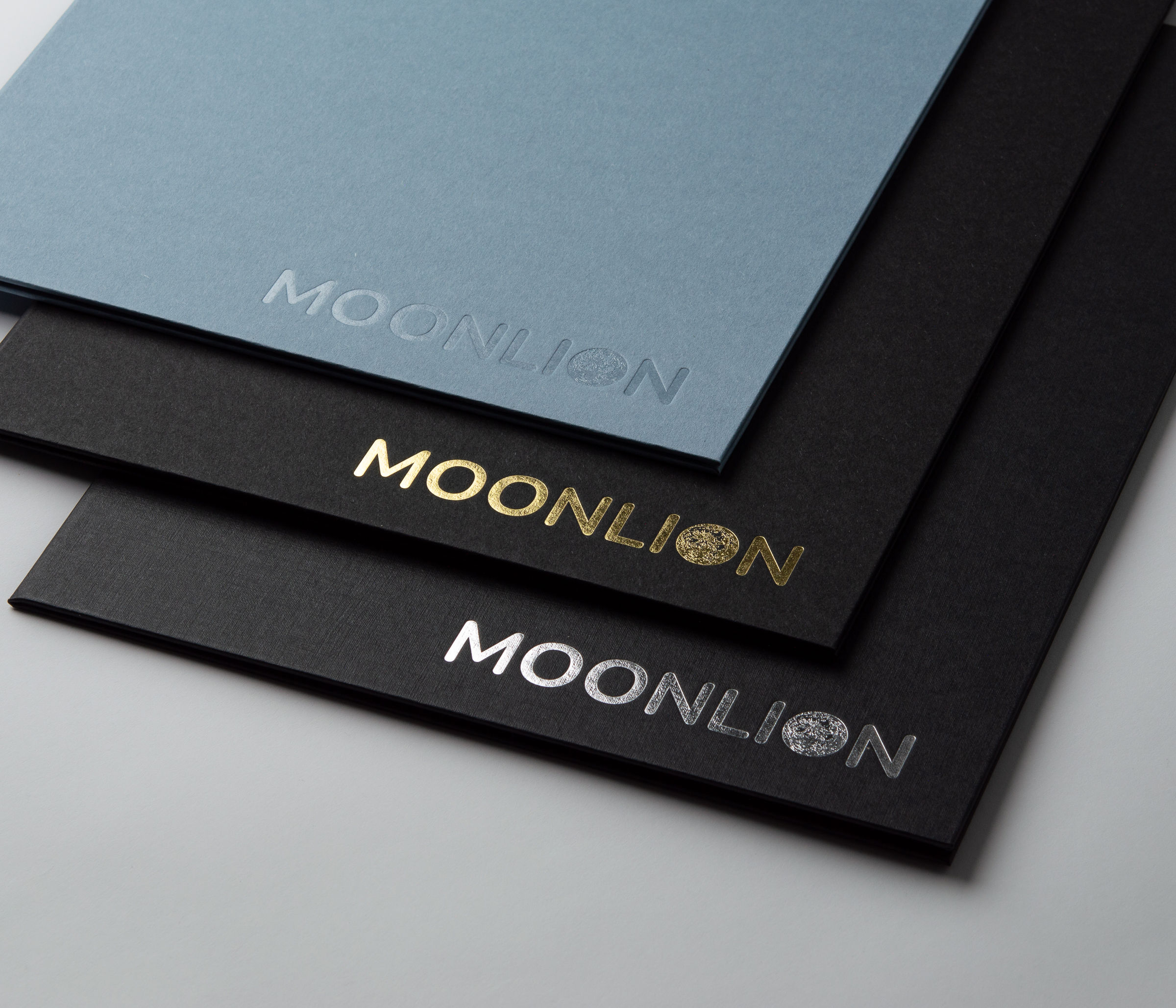 Different hot foil embossings in silver, gold and transparent